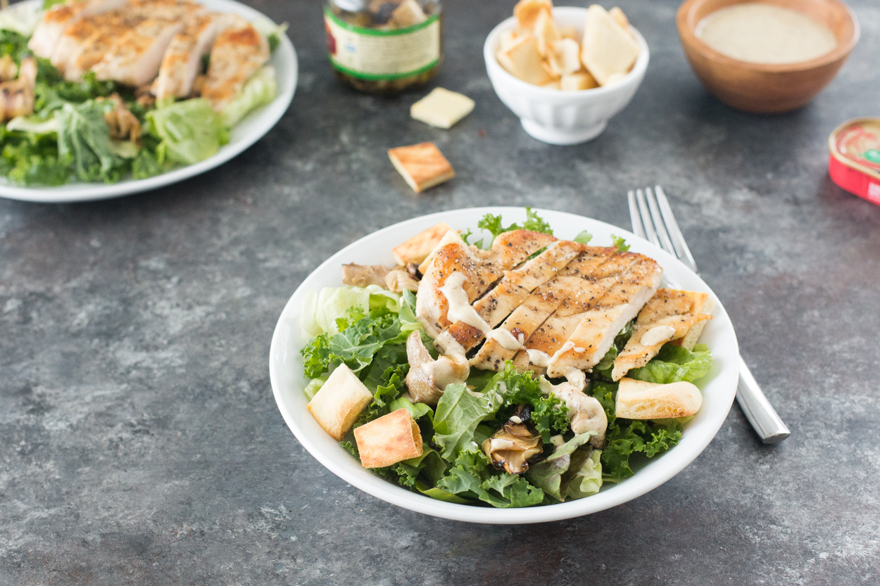 Lemon-Pepper Chicken over Kale Caesar Salad
