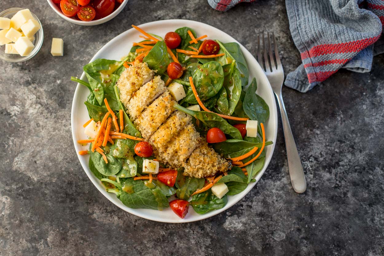 Baked Chicken Tenders over Baby Spinach