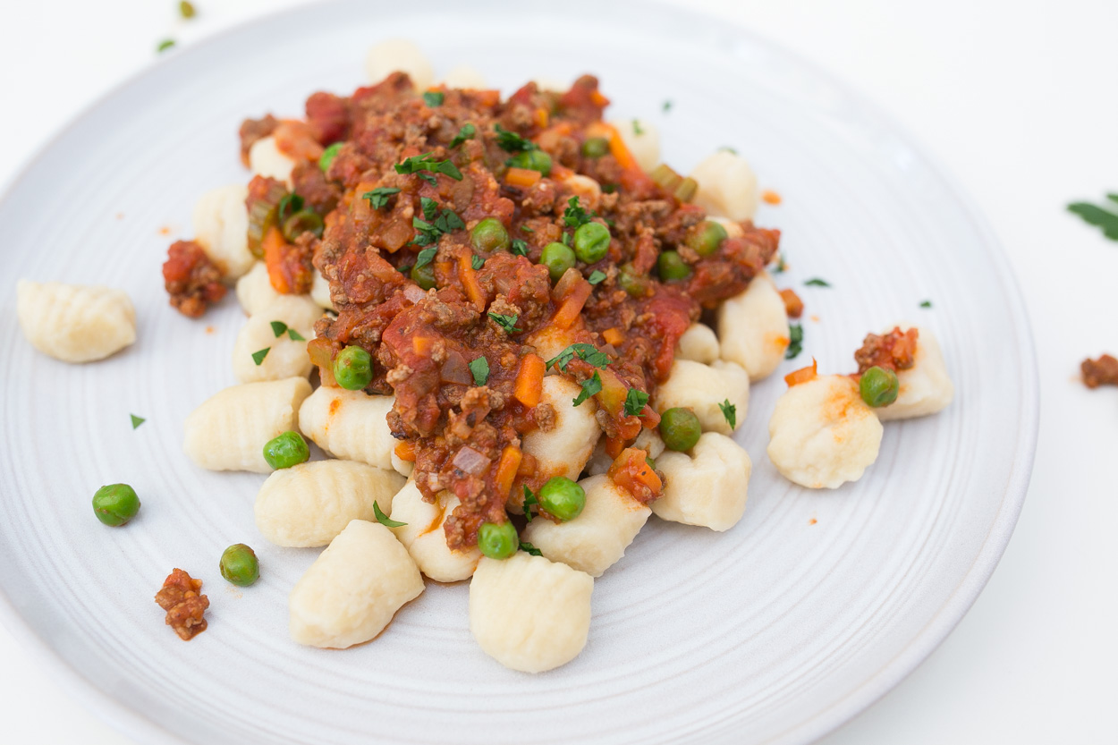 Carrot and Peas Bolognese over Leftover Roasted Sweet Potatoes